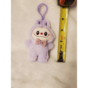 Purple Labubu stuffed keychain featuring a stylish bow tie.